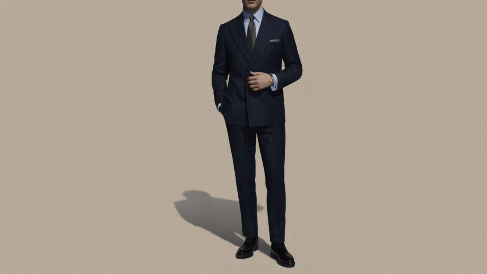  A detailed 3D representation of a man dressed in a suit, emphasizing a polished and professional look.
