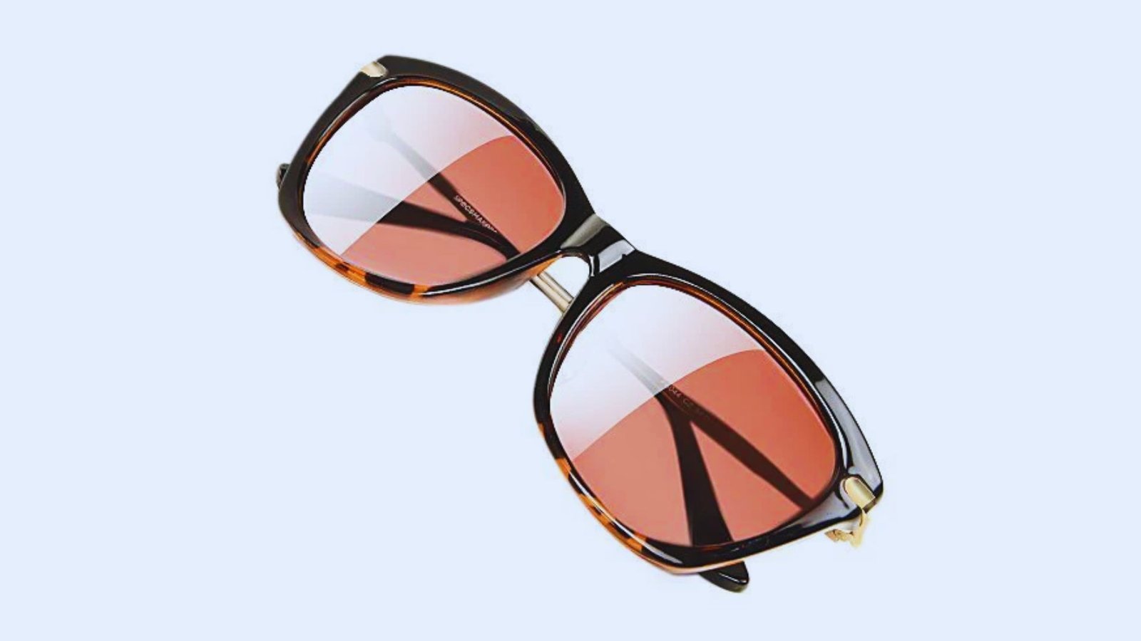 Stylish sunglasses with clear lenses, suitable for various occasions and providing UV protection.