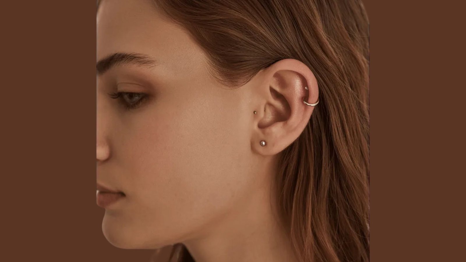 A woman wearing elegant earrings, showcasing her style and adding a touch of sophistication to her look.