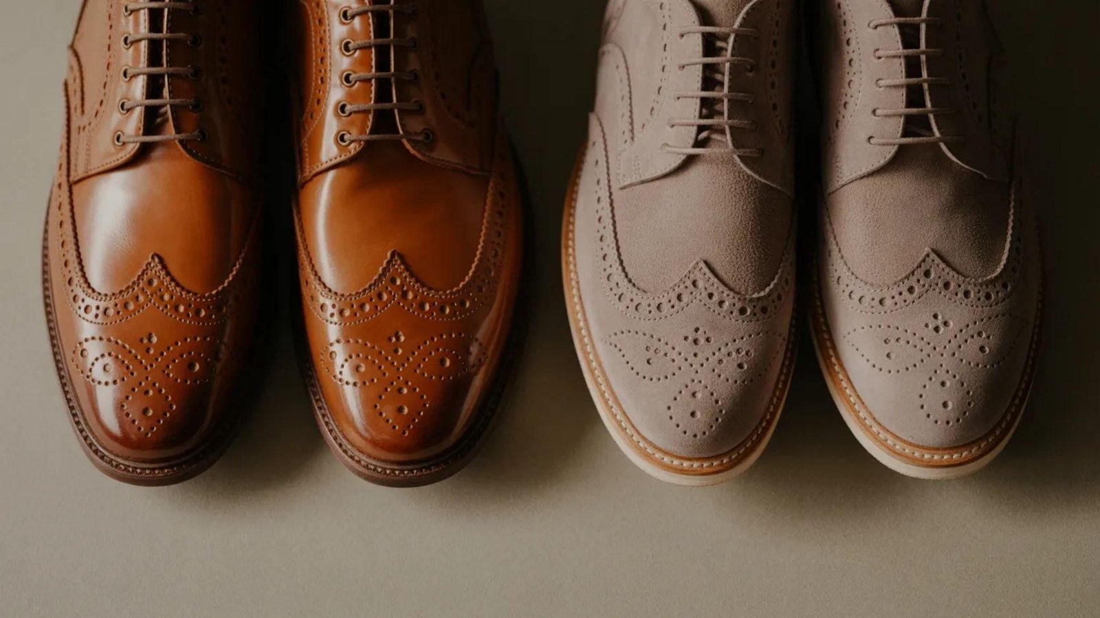  Two pairs of shoes displayed: one pair is brown and the other is tan, showcasing different styles and colors.