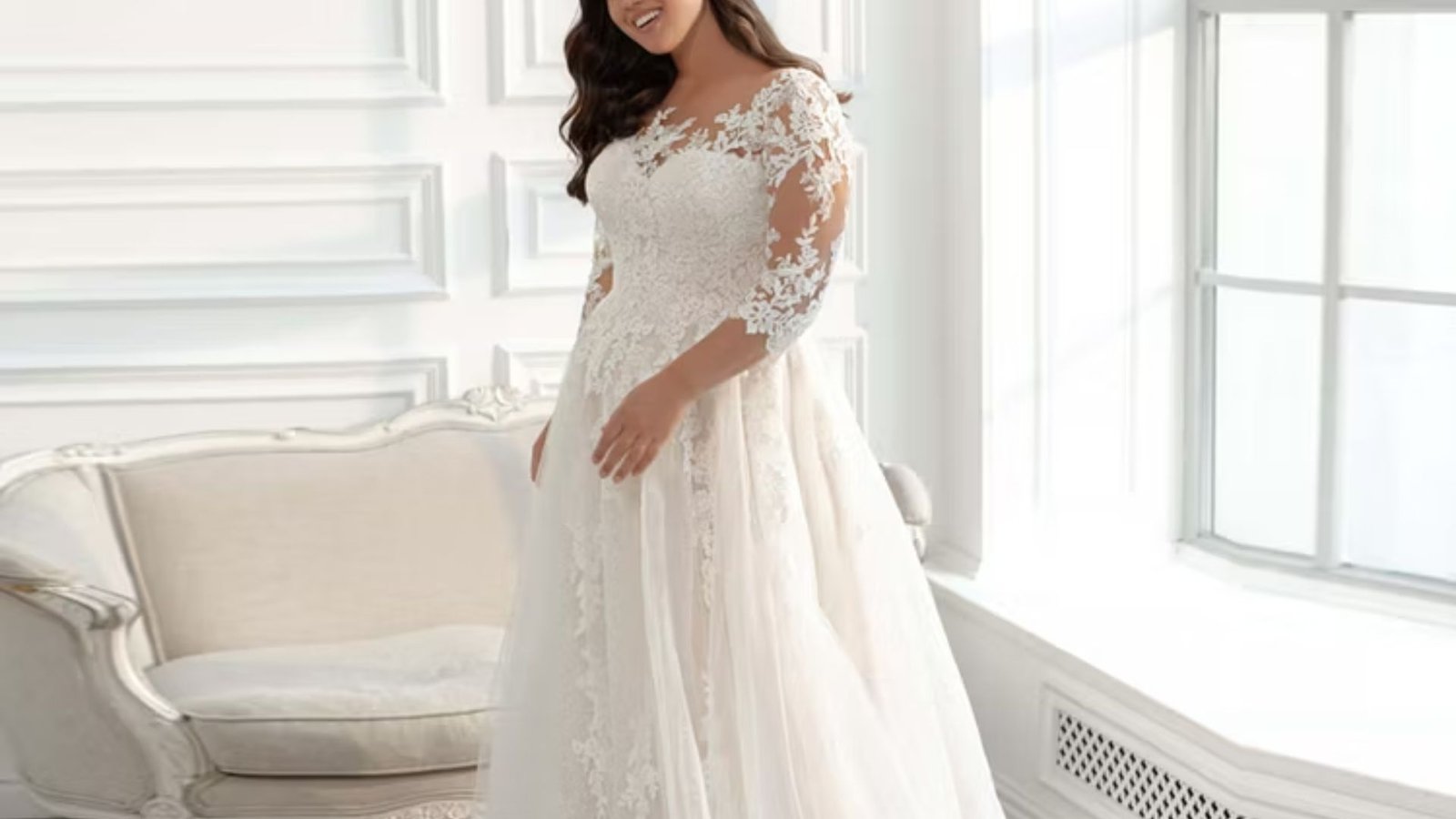 Elegant white wedding dress with long sleeves, showcasing a classic and timeless design for a bride's special day.