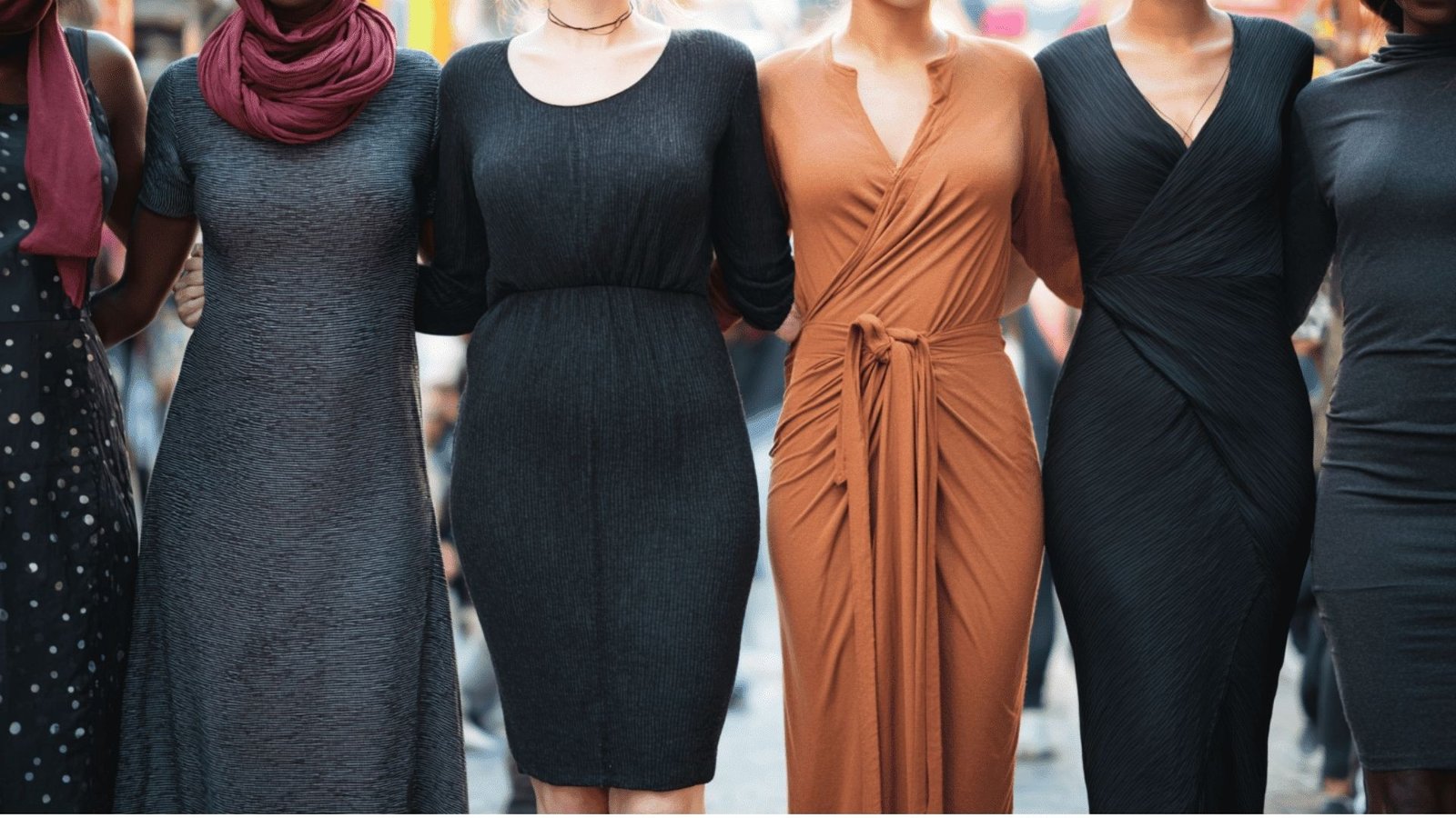 Five women in colorful dresses, showcasing various styles including sheath and shift, standing together in a bright setting.