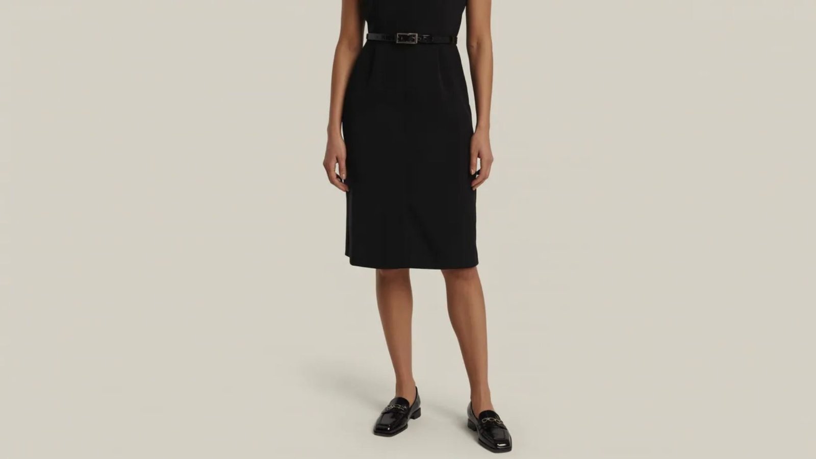 A black dress made from soft, stretchy fabric, showcasing a sleek and comfortable design suitable for various occasions.