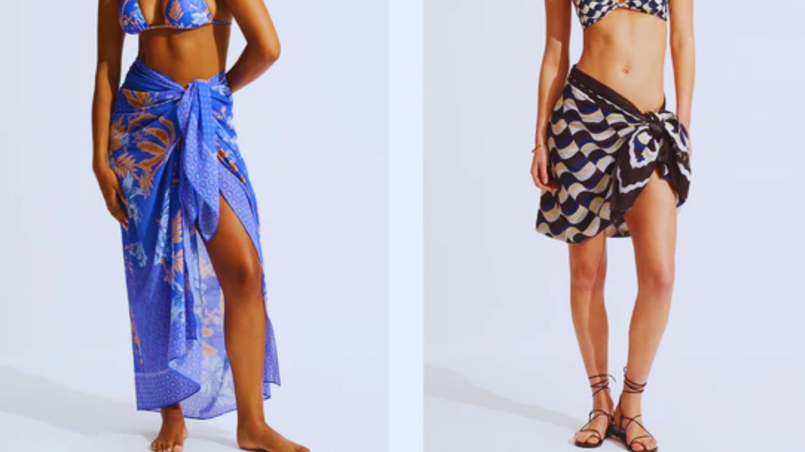  Three women wearing bikinis and sarongs pose together, smiling against a sunny beach backdrop.