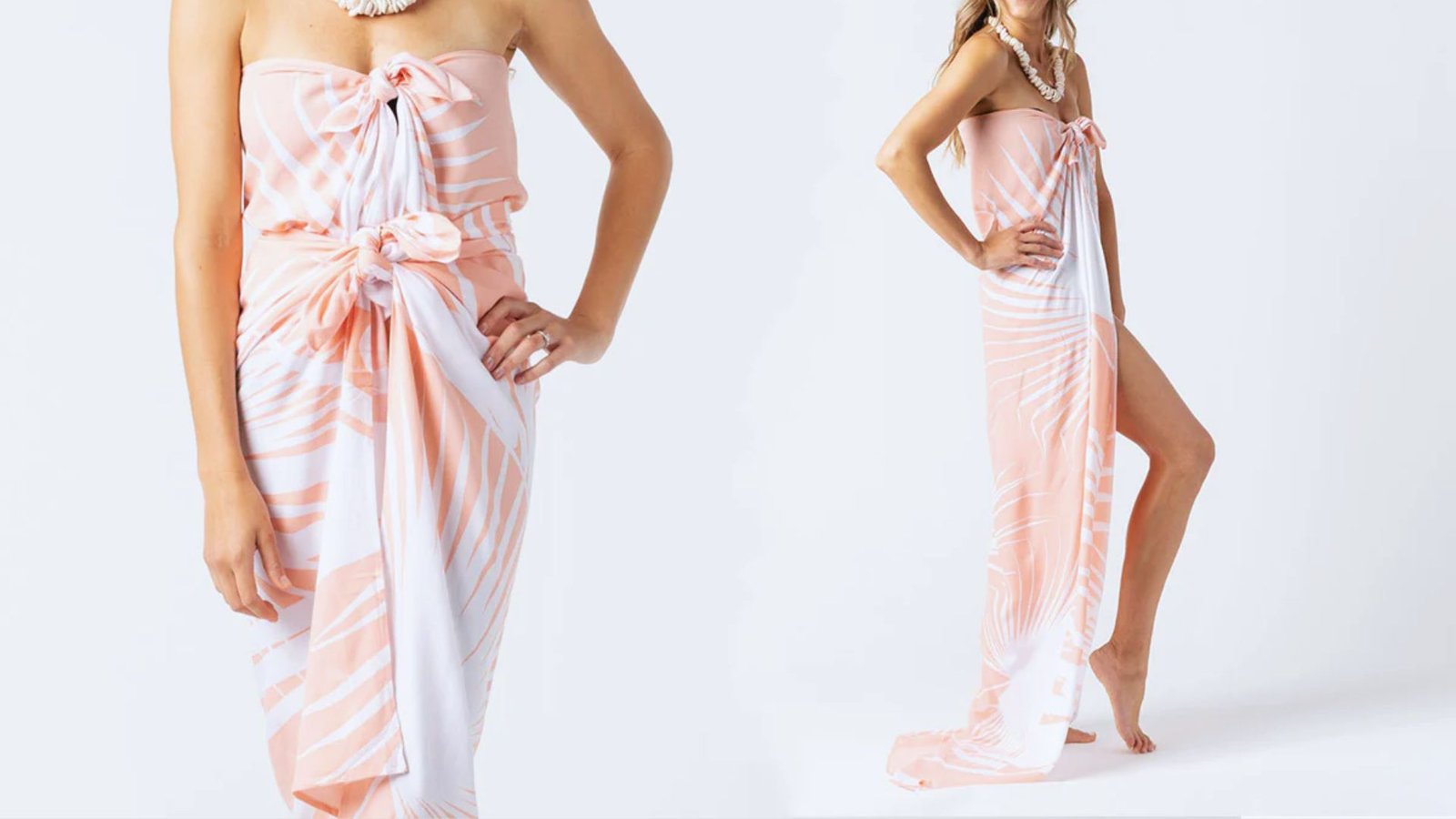  A woman wearing a white and pink dress stands gracefully, showcasing a blend of soft colors and elegant design.