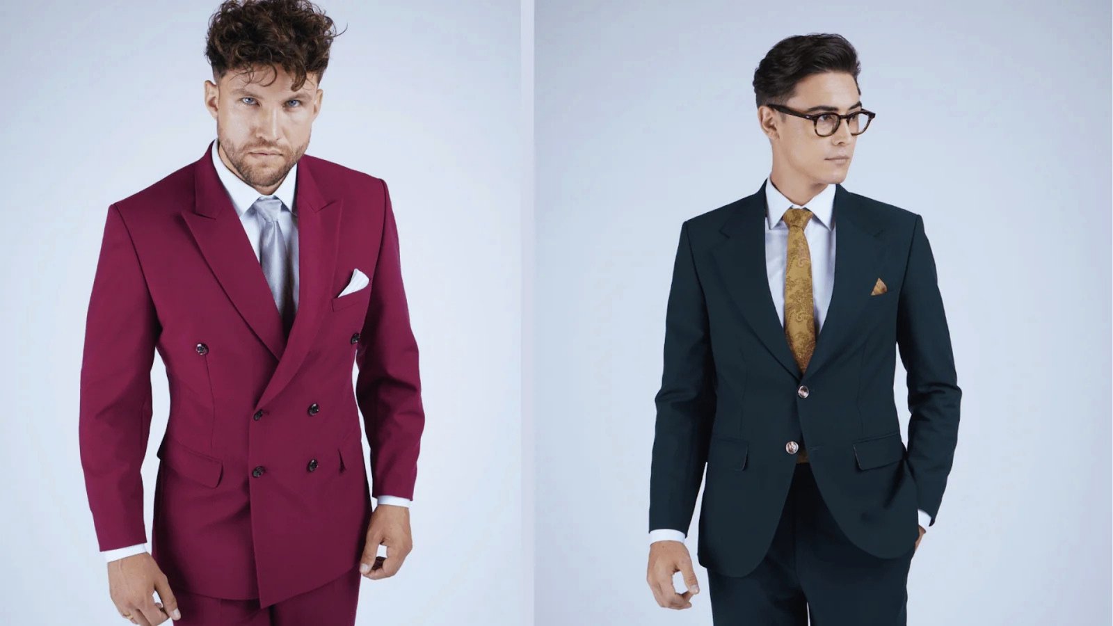 Two men in suits stand side by side. The left wears a maroon double-breasted suit, exuding confidence, while the right sports a modern navy suit with glasses, looking contemplative.