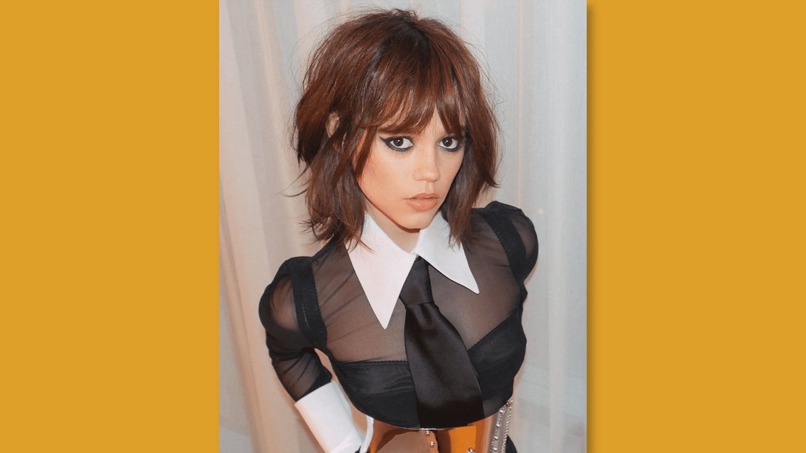 Low maintenance layered chin length shag with choppy bangs and textured ends on auburn brown hair for round face 

