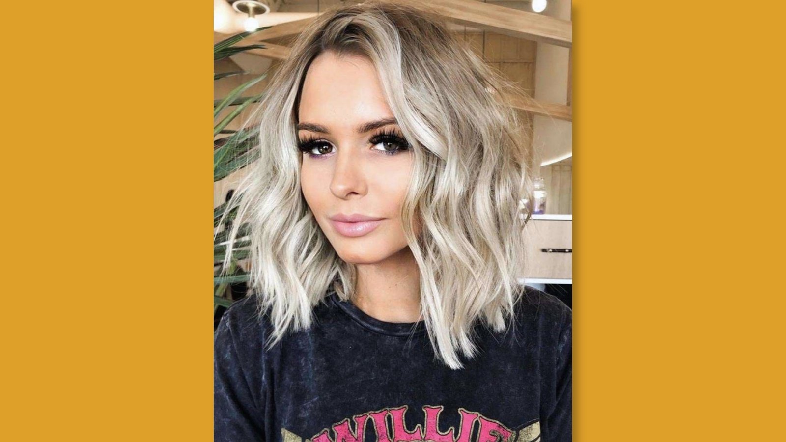 Low maintenance straight medium length layered haircut with soft curtain bangs and face-framing layers on blonde hair for round face
