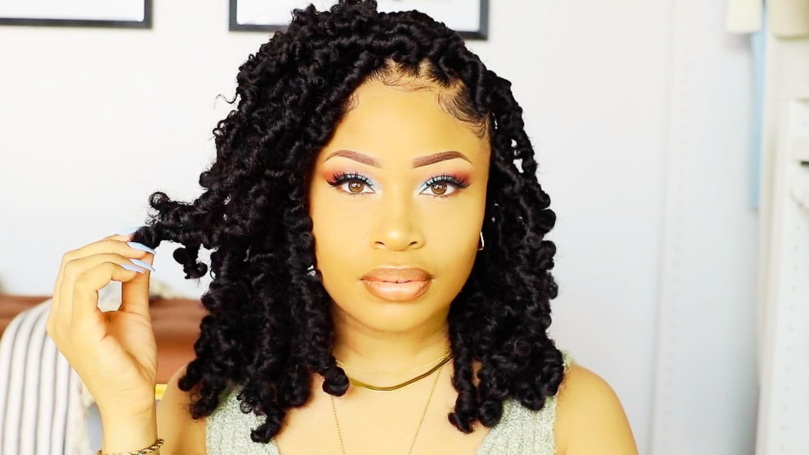 A woman with long black hair, Butterfly Faux Locs Styles