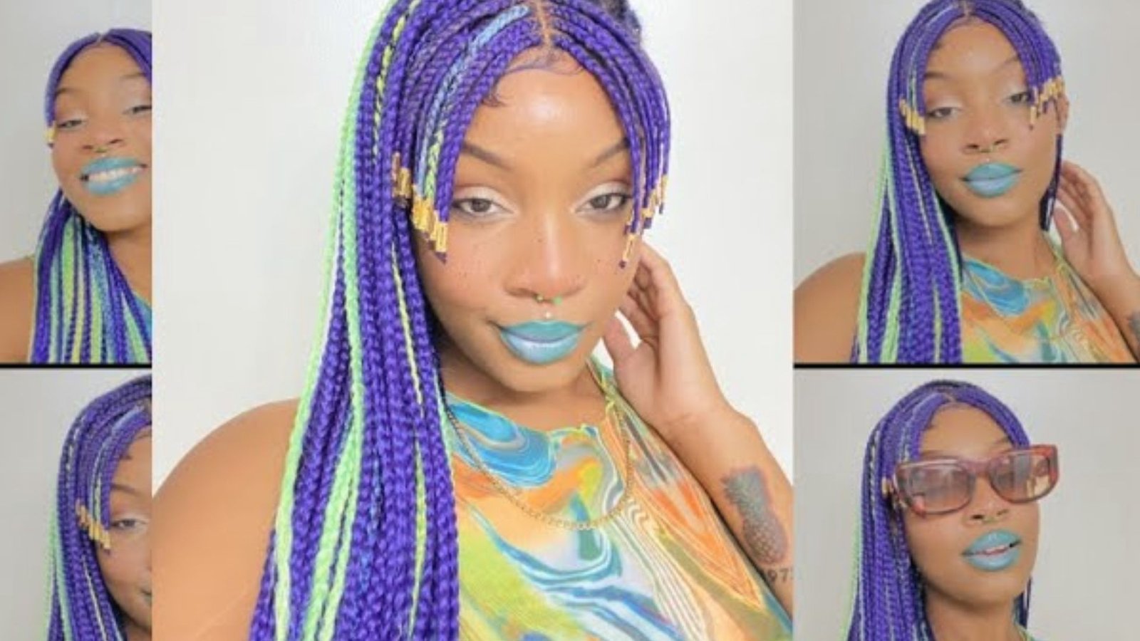 A woman with a braided mullet hairstyle featuring vibrant blue and purple braids.