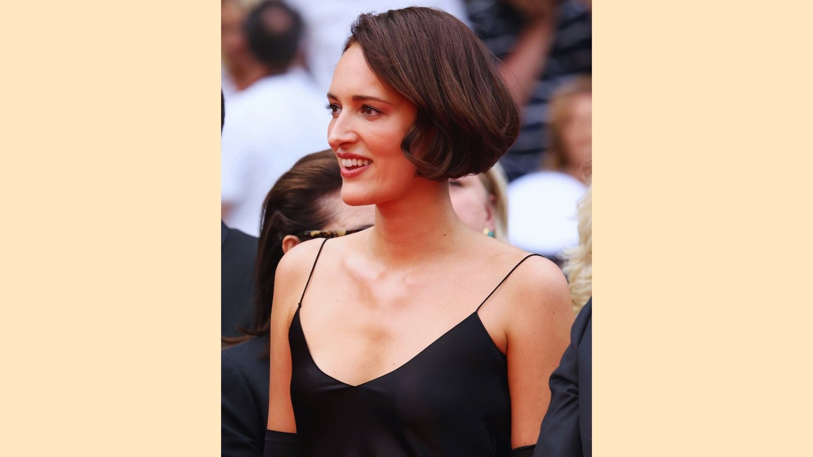 Polished French bob without bangs on glossy brunette hair with rounded shape and deep side part