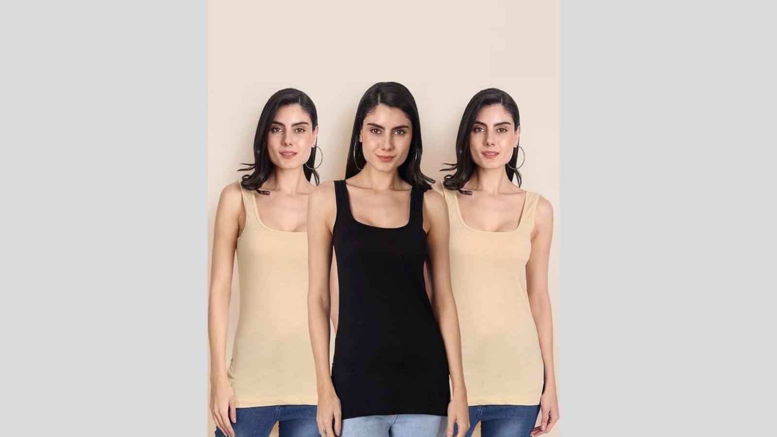 Three women stand side by side wearing sleeveless tops; the outer two wear beige tops with blue jeans, and the middle one wears a black top. Their expressions are neutral.