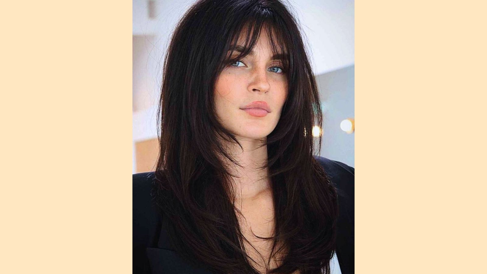 Long straight dark brown layered hair with wispy see-through curtain bangs and subtle face-framing