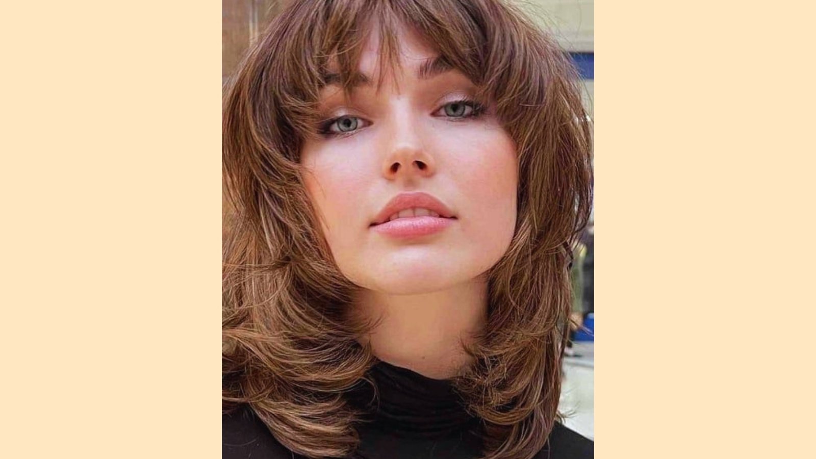 Medium length layered shag with wispy curtain bangs and choppy face-framing layers on light brown hair